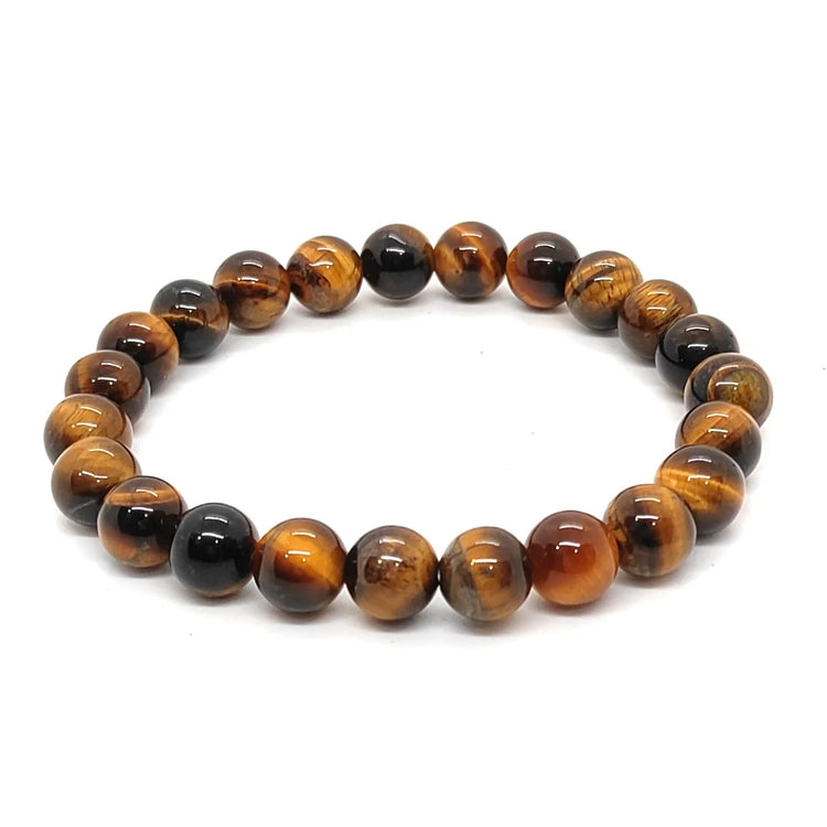 :Natural round beaded Tiger's Eye gemstone healing stretch bracelet on a white background by Bright Blue Gemstones